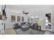 Bright living room with tile floors, gray sectional, and a ceiling fan at 9282 E Desert Vw, Scottsdale, AZ 85255