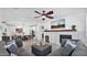 Open-concept living room with a fireplace, a TV, and a view of the kitchen at 9282 E Desert Vw, Scottsdale, AZ 85255