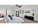 Spacious main bedroom with a ceiling fan, large windows, and a modern dresser at 9282 E Desert Vw, Scottsdale, AZ 85255