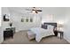 Bright main bedroom features a decorative headboard, neutral tones, and a ceiling fan at 9282 E Desert Vw, Scottsdale, AZ 85255