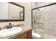 Bathroom featuring a vanity with ample storage, a framed mirror, and a glass-enclosed shower at 103 W Tanya Rd, Phoenix, AZ 85086