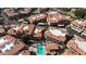 Stunning aerial view of a beautiful residential community with a sparkling pool and well-maintained red-tiled roofs at 10410 N Cave Creek Rd # 1032, Phoenix, AZ 85020