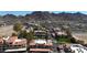 Extensive aerial view showcasing community landscaping with red-tile roofs set against a backdrop of desert mountains at 10410 N Cave Creek Rd # 1032, Phoenix, AZ 85020