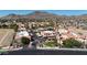 Wide aerial view showcasing community landscaping with red-tile roofs in a desert setting with distant mountains at 10410 N Cave Creek Rd # 1032, Phoenix, AZ 85020