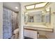 Well-lit bathroom with a combination shower and tub, a vanity with mirror, and floral accents at 10410 N Cave Creek Rd # 1032, Phoenix, AZ 85020