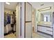 Bathroom with a walk-in closet and neutral tones at 10410 N Cave Creek Rd # 1032, Phoenix, AZ 85020