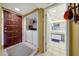 Hallway view of the bathroom, showcasing tiled flooring and storage spaces at 10410 N Cave Creek Rd # 1032, Phoenix, AZ 85020