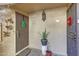 Front doors with security doors and outdoor decor create a welcoming entrance at 10410 N Cave Creek Rd # 1032, Phoenix, AZ 85020