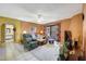 Cozy living room featuring tile floors, comfortable seating, a ceiling fan and access to the outdoor space at 10410 N Cave Creek Rd # 1032, Phoenix, AZ 85020