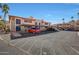 Exterior of a residential building featuring covered parking spaces for residents' convenience with mountain views at 10410 N Cave Creek Rd # 1032, Phoenix, AZ 85020