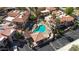 Aerial view of a sparkling community pool surrounded by landscaped grounds and cozy seating areas at 10410 N Cave Creek Rd # 1032, Phoenix, AZ 85020