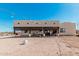 Back exterior of a large home with covered patio and outdoor seating at 12216 S 214Th Ave, Buckeye, AZ 85326