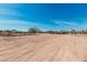 Expansive land with desert landscaping and distant mountain views at 12216 S 214Th Ave, Buckeye, AZ 85326