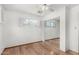 Another bedroom angle with hardwood floors and window with white shutters and a mirrored closet at 1320 W Mariposa St, Phoenix, AZ 85013