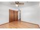 Cozy bedroom with wood floors, a closet, and neutral wall color at 1320 W Mariposa St, Phoenix, AZ 85013