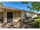 Welcoming home entrance with an ornate security door, brick-paved porch, and awnings for added charm at 1320 W Mariposa St, Phoenix, AZ 85013