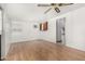 Well-lit living room with hardwood floors, white walls and an air conditioning unit at 1320 W Mariposa St, Phoenix, AZ 85013