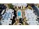 Aerial view of the apartment complex and community pool, showcasing a tranquil and well-maintained living environment at 1340 N Recker Rd # 219, Mesa, AZ 85205