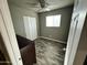 Cozy bedroom with ceiling fan, natural light from a single window, and contemporary flooring at 14024 W Noble Cir, Casa Grande, AZ 85122