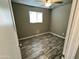 Bedroom with a ceiling fan, natural light from a window, and contemporary flooring at 14024 W Noble Cir, Casa Grande, AZ 85122