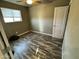 Bedroom features contemporary flooring, natural light from a window, and simple closet at 14024 W Noble Cir, Casa Grande, AZ 85122