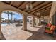 Expansive outdoor lounge area featuring a beautiful stone fountain, seating and a covered patio at 14200 W Village Pkwy # 107, Litchfield Park, AZ 85340