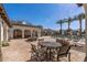 Outdoor seating area with large stone fountain overlooking community pool at 14200 W Village Pkwy # 107, Litchfield Park, AZ 85340