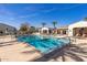 Relaxing community pool with lounge chairs and shaded seating areas at 14200 W Village Pkwy # 107, Litchfield Park, AZ 85340