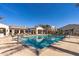 Beautiful community pool with plenty of lounge chairs and umbrellas at 14200 W Village Pkwy # 107, Litchfield Park, AZ 85340