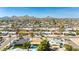 Enjoy serene skies in this aerial view of the neighborhood. Property includes pool, backyard putting green, and trees at 14433 N 37Th St, Phoenix, AZ 85032