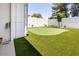 Backyard putting green for outdoor enjoyment and a relaxing recreational space at 14433 N 37Th St, Phoenix, AZ 85032