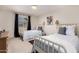 Bright, naturally lit bedroom offers twin beds, neutral walls, and updated sconces at 14433 N 37Th St, Phoenix, AZ 85032