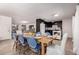 Bright dining area features an open floor plan, sleek tile floors, and stylish modern furnishings at 14433 N 37Th St, Phoenix, AZ 85032