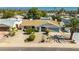 Charming single-story home featuring desert landscaping, a spacious driveway, and an attached garage at 14433 N 37Th St, Phoenix, AZ 85032