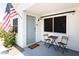 Covered porch with a charming outdoor seating area, front door, and a view of the front yard at 14433 N 37Th St, Phoenix, AZ 85032