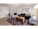 Bright and airy living room featuring stylish furnishings, neutral walls, and an open floor plan at 14433 N 37Th St, Phoenix, AZ 85032