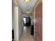 Welcoming entryway with tile flooring, a view into the living area, and natural light from the front door at 1606 S 226Th Dr, Buckeye, AZ 85326