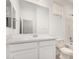 Bathroom featuring a large mirror and bright white cabinets at 16804 W Yucatan Dr, Surprise, AZ 85388