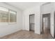 Bedroom with a window, neutral walls, and bright, natural light at 16804 W Yucatan Dr, Surprise, AZ 85388