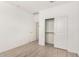 Neat bedroom with closet, and neutral walls and wood-look tile floor at 16804 W Yucatan Dr, Surprise, AZ 85388