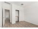 Bedroom with closet, and neutral walls and wood-look tile floor at 16804 W Yucatan Dr, Surprise, AZ 85388