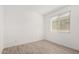 Bedroom with a neutral paint, wood-look tile floor, and bright, natural light at 16804 W Yucatan Dr, Surprise, AZ 85388