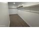 Empty walk in closet with carpet and shelving at 16954 W Molly Ln, Surprise, AZ 85387