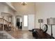 Bright entryway featuring tile flooring, staircase, soaring ceilings, and modern chandelier at 1765 N Agave St, Casa Grande, AZ 85122