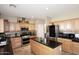 Well-equipped kitchen featuring stainless steel appliances and a center island with granite countertops at 1765 N Agave St, Casa Grande, AZ 85122