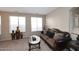 Cozy formal living room with plush seating, decorative vases, and bright windows offering ample natural light at 1765 N Agave St, Casa Grande, AZ 85122