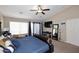 Serene main bedroom with a cozy bed, a desk for work, and warm, inviting decor at 1765 N Agave St, Casa Grande, AZ 85122