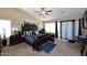 Large main bedroom featuring tray ceilings, decorative mirrors and black out curtains at 1765 N Agave St, Casa Grande, AZ 85122