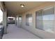 A covered outdoor patio with multiple sliding glass doors at 1765 N Agave St, Casa Grande, AZ 85122