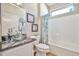 Bathroom featuring glass sink and faucet, bathtub with shower, and decorative art at 19437 N Guardian Ln, Surprise, AZ 85387